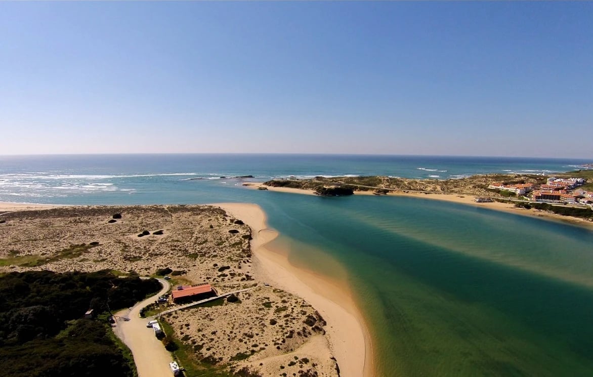View of the Vila Nova de Milfontes coastline at sunset